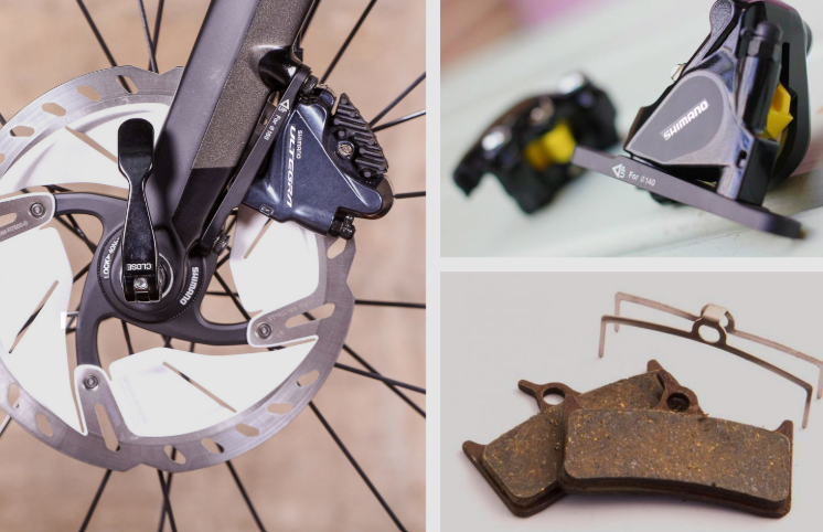 Worn bike brake pads next to a new set, ready to be fitted