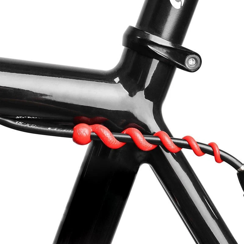 Red spiral cable protector wrapped around a cable at the seat tube
