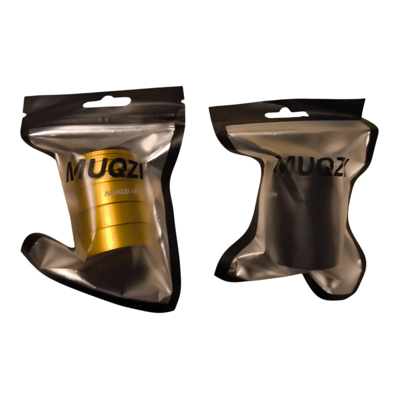 Gold and black headset spacer kits in their resealable retail pouches