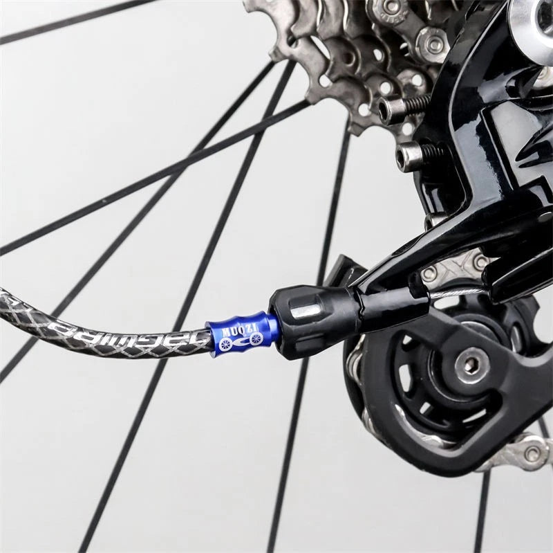 Blue alloy cable end cap fitted at the rear derailleur