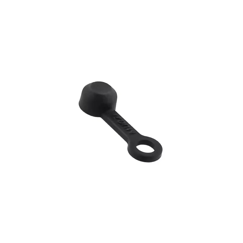 A single black silicone bleed nipple cover