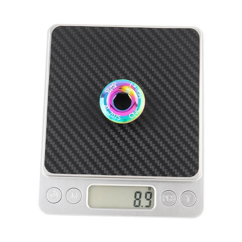 Rainbow crank bolt cap weighed on digital scales at 8.9 grams