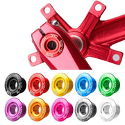 Red crank bolt cap fitted to a crankset with the full colour range below it