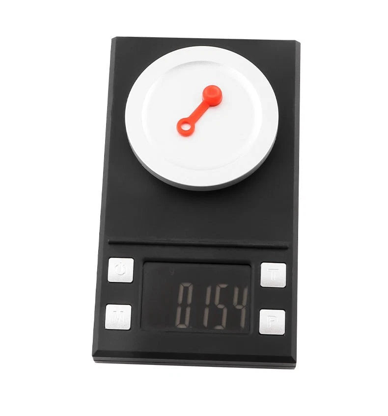 Red bleed nipple cover weighed on precision scales at 0.154 grams