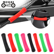 Silicone cable protectors in black, red, green and pink, with one fitted to a frame